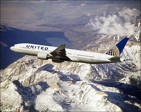 United Airlines Boeing 777-200 Over Mountains Photo Print for Sale