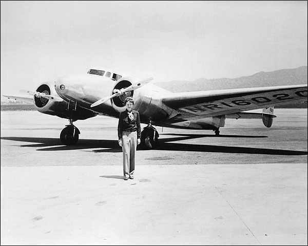 Amelia Earhart with her Lockheed Electra Photo Print for Sale