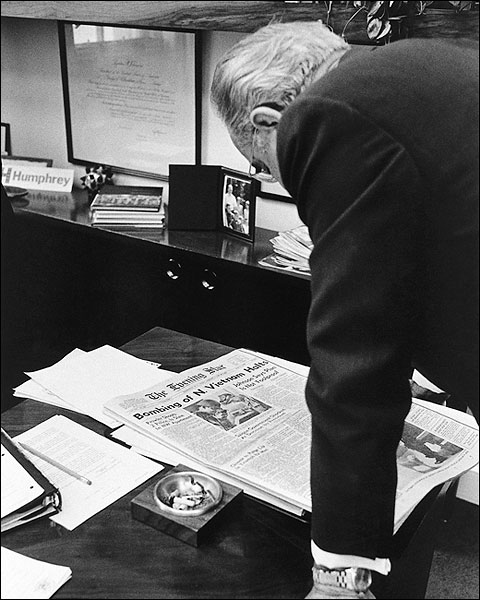 President Lyndon B. Johnson Reads Newspaper About Bombing Halt In Vietnam Photo Print For Sale